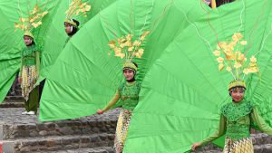 Indonesian dancers stand prior to their performing during the 2018 Mi