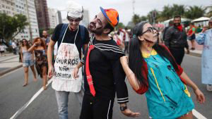 Revellers take part in the annual Zombie Walk at Copacabana beach in