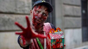 A reveller poses for a picture during the annual Zombie Walk in Sao P