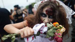 A woman takes part in the annual Zombie Walk at Copacabana beach in R