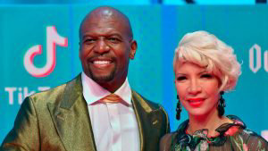 US actor Terry Crews and his wife Rebecca King-Crews pose on the red