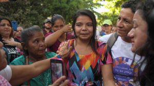 TOPSHOT - Imelda Cortez (C) is accompanied by relatives after she was