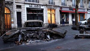 A picture shows charred cars in a street of Paris on December 2