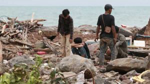 Rescuers look for survivors along the coast in South Lampung on South