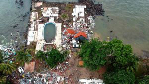 TOPSHOT - An aerial photo shows damaged buildings in Carita on Decemb