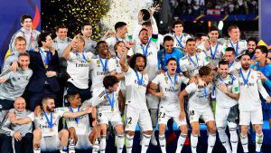 Real Madrid's players celebrate with the trophy after winning the FIF