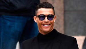 uventus' forward and former Real Madrid player Cristiano Ronaldo smil
