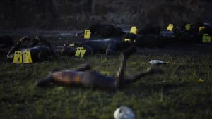 EDITORS NOTE: Graphic content / The bodies of burned persons are seen