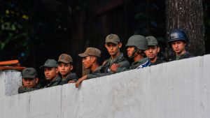 Members of the Bolivarian National Guard remain inside Cotiza Bolivar