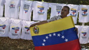 A man sells tshirts near the place where 