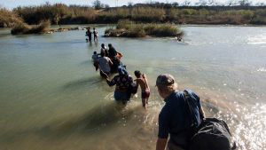 Central American migrants try to cross the Rio Bravo
