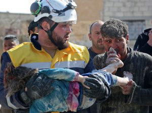 TOPSHOT - EDITORS NOTE: Graphic content / A Syrian man (R) kisses the