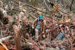 Joey Roush walks through debris March 4