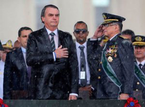 Brazilian President Jair Bolsonaro (C)