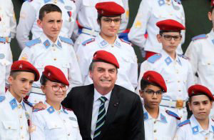 Brazilian President Jair Bolsonaro poses with students of the Militar