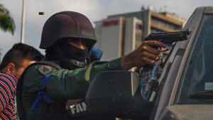 TOPSHOT - A member of the Bolivarian National Guard who joined Venezu