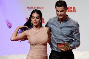 Portugal and Juventus forward Cristiano Ronaldo poses with his partne