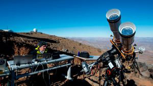 An astronomer prepares equipment ahead of a solar eclipse at the La S