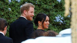 18727844-7489021-Prince_Harry_and_Meghan_Markle_smile_as_they_arrive_for_the_suns-a-19_1569068884830