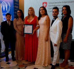 Salvadoran transgender Bianka Rodriguez (C) poses after receiving the