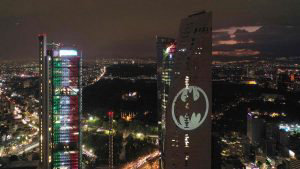 Aerial view of the Batman's symbol projected over the Reforma Tower o