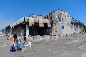 Partial view of 'Lider' supermarket a day after it was burned during