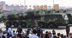 Military vehicles carrying DF-100 ground-based land-attack missiles p