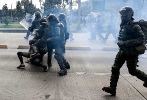 EDITORS NOTE: Graphic content / Riot police detain a demonstrator in