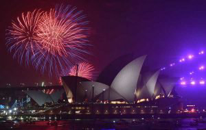 TOPSHOT - New Year's Eve fireworks erupt over Sydney's iconic Harbour