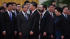 China's President Xi Jinping (C) walks with El Salvador's President N