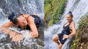 Yajaira detiene el tráfico al bañarse en cascada a orillas de una carretera
