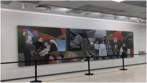Pintura-mural de San Romero ya se exhibe de nuevo en el aeropuerto