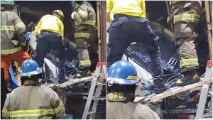 Los equipos de socorristas trabajador para recuperar el cadáver