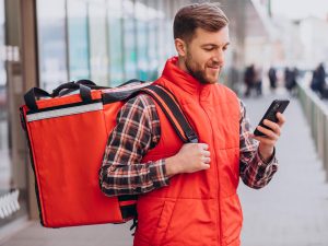 Food delivery man with boxes with food